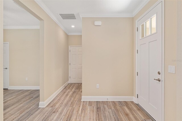 9923 SW 98th Ln, Ocala, FL 34481 - entryway with ornamental molding, light wood finished floors, visible vents, and baseboards