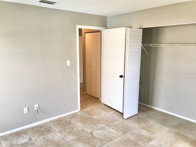 5440 SE 30th Pl, Ocala, FL 34480 - unfurnished bedroom with a closet, baseboards, and visible vents