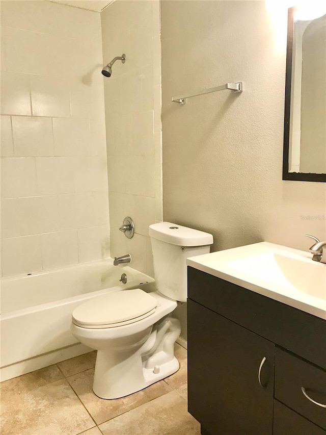 5440 SE 30th Pl, Ocala, FL 34480 - full bath featuring vanity, tile patterned floors, toilet, and  shower combination