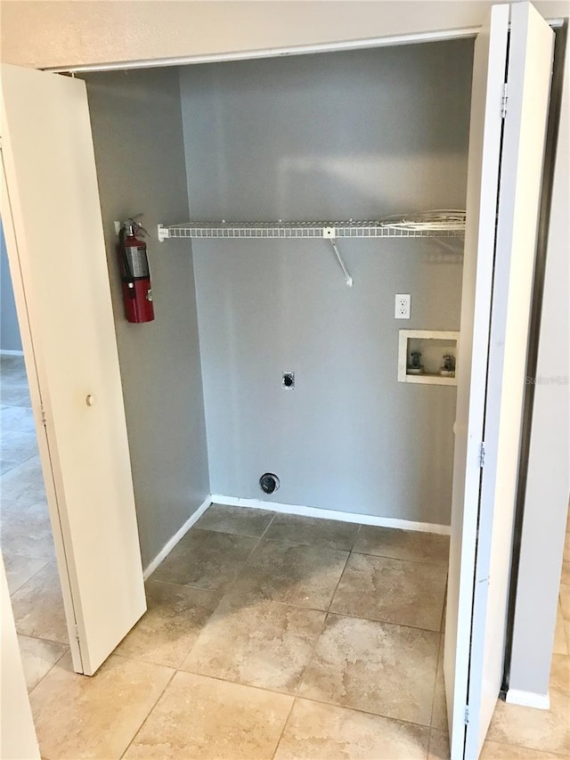5440 SE 30th Pl, Ocala, FL 34480 - laundry room with baseboards, laundry area, electric dryer hookup, and hookup for a washing machine