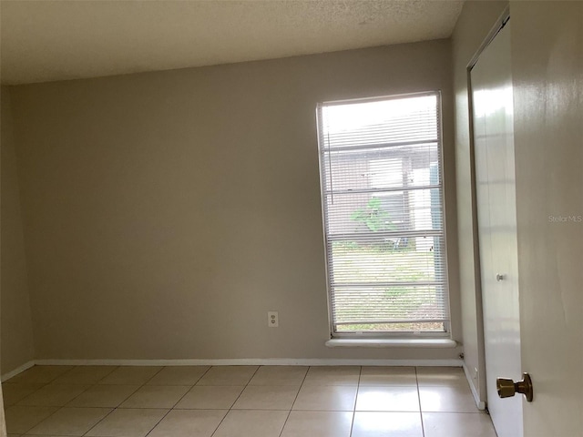 5440 SE 30th Pl, Ocala, FL 34480 - empty room with baseboards and light tile patterned floors