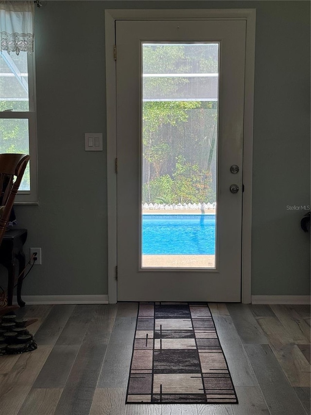 8951 SW 202nd Avenue Rd, Dunnellon, FL 34431 - entryway featuring baseboards and wood finished floors