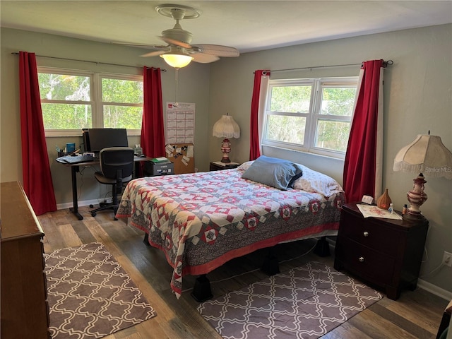 8951 SW 202nd Avenue Rd, Dunnellon, FL 34431 - bedroom featuring wood finished floors, a desk, baseboards, and ceiling fan