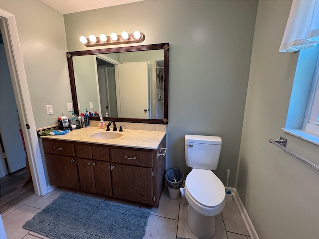 8951 SW 202nd Avenue Rd, Dunnellon, FL 34431 - bathroom with tile patterned floors, vanity, toilet, and baseboards