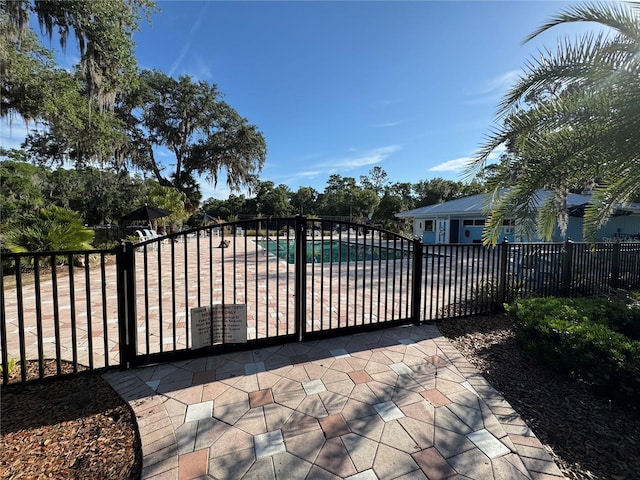 8951 SW 202nd Avenue Rd, Dunnellon, FL 34431 - gate with a community pool and a patio