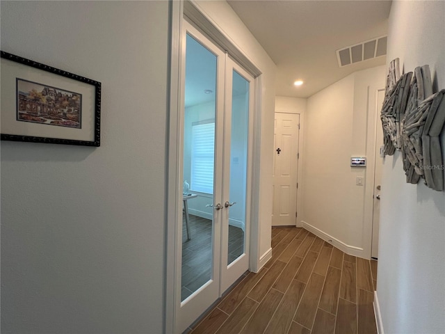 5785 SW 87th Court Rd, Ocala, FL 34481 - hallway with dark wood finished floors, baseboards, french doors, and recessed lighting