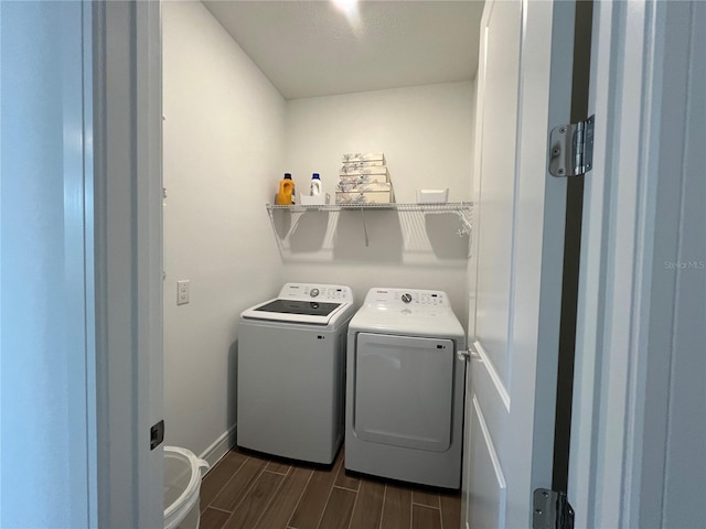 5785 SW 87th Court Rd, Ocala, FL 34481 - washroom featuring wood finish floors, washer and clothes dryer, and baseboards