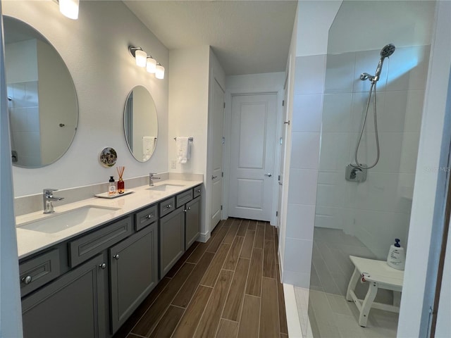 5785 SW 87th Court Rd, Ocala, FL 34481 - full bath with double vanity, tiled shower, and wood finished floors