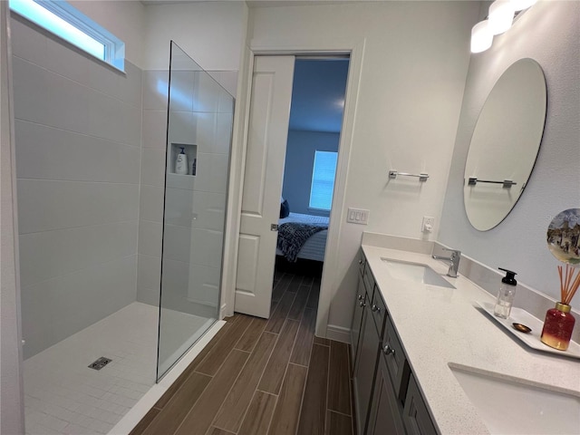 5785 SW 87th Court Rd, Ocala, FL 34481 - ensuite bathroom featuring wood tiled floors, walk in shower, double vanity, and baseboards