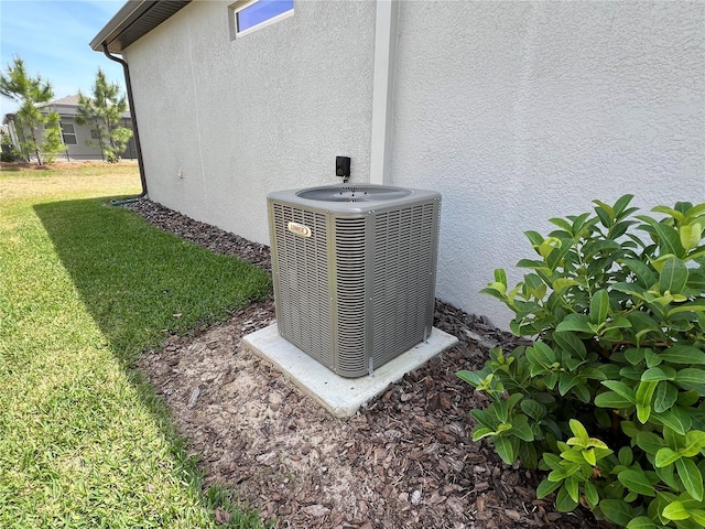 5785 SW 87th Court Rd, Ocala, FL 34481 - exterior view of central air condition unit and stucco siding