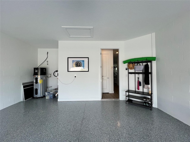 5785 SW 87th Court Rd, Ocala, FL 34481 - garage featuring water heater and concrete block wall