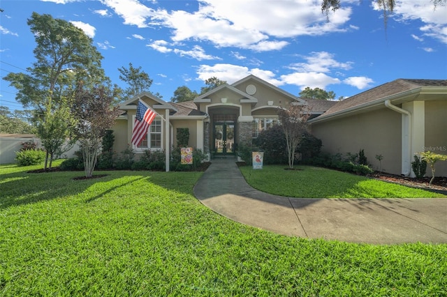 811 SE 49th Ave, Ocala, FL 34471 - view of front of property with french doors, stucco siding, and a front lawn