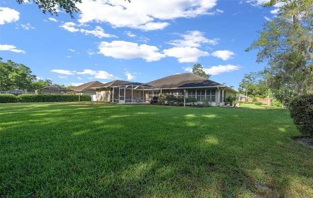 811 SE 49th Ave, Ocala, FL 34471 - back of property featuring a yard and glass enclosure