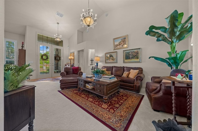 811 SE 49th Ave, Ocala, FL 34471 - living area featuring carpet flooring, high vaulted ceiling, a chandelier, and visible vents
