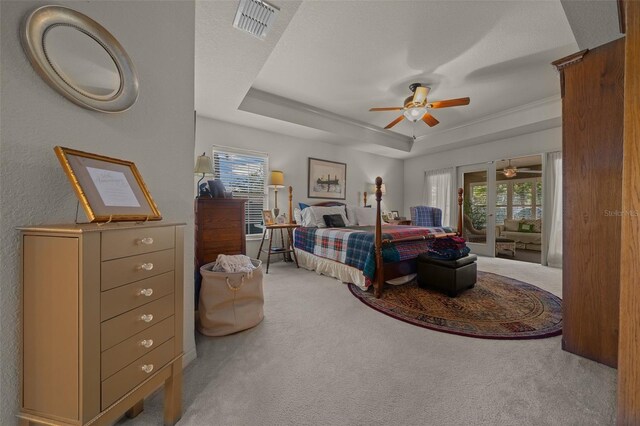 811 SE 49th Ave, Ocala, FL 34471 - bedroom with a raised ceiling, light colored carpet, multiple windows, and visible vents