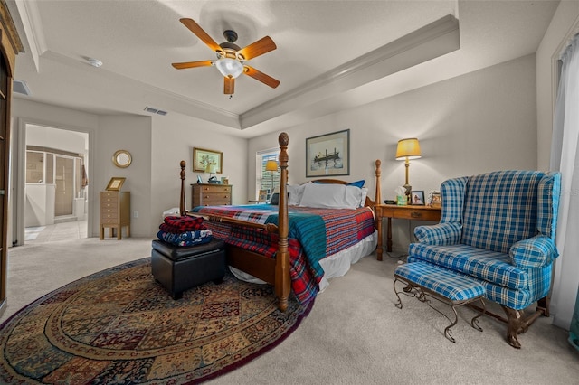 811 SE 49th Ave, Ocala, FL 34471 - bedroom with visible vents, ornamental molding, ceiling fan, a tray ceiling, and carpet