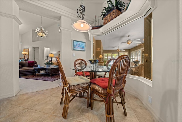 811 SE 49th Ave, Ocala, FL 34471 - dining space featuring light tile patterned flooring, baseboards, a high ceiling, and ceiling fan with notable chandelier