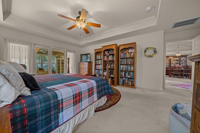 811 SE 49th Ave, Ocala, FL 34471 - bedroom with carpet floors, ornamental molding, a tray ceiling, and visible vents