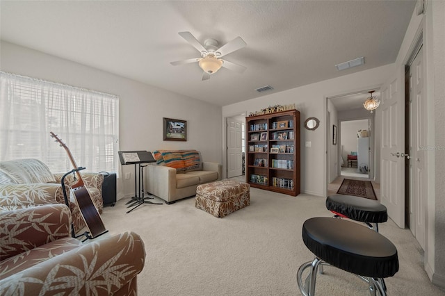 811 SE 49th Ave, Ocala, FL 34471 - living area with visible vents, a ceiling fan, and light carpet