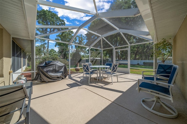 811 SE 49th Ave, Ocala, FL 34471 - view of patio / terrace with a lanai, outdoor dining space, a fenced backyard, and a grill