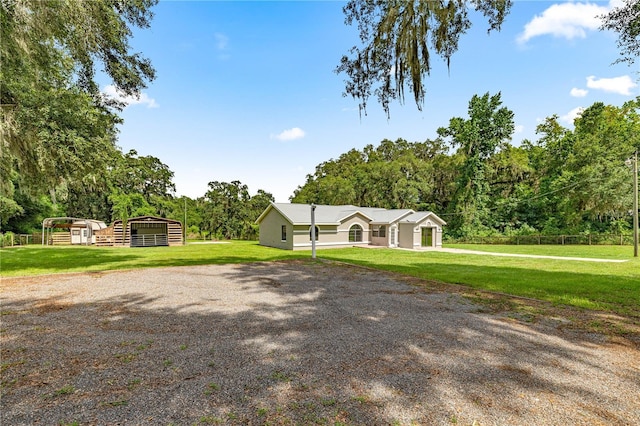 14171 SW 8th Ave, Ocala, FL 34473 - view of front of property with a front lawn and gravel driveway