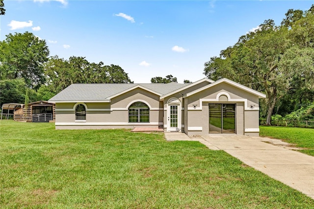 14171 SW 8th Ave, Ocala, FL 34473 - ranch-style home featuring a front yard and stucco siding