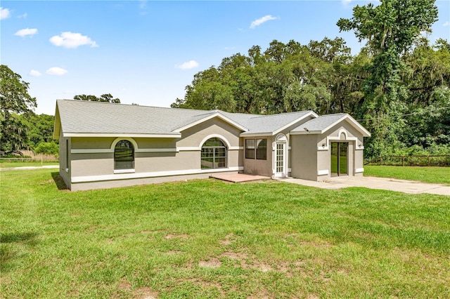 14171 SW 8th Ave, Ocala, FL 34473 - single story home featuring stucco siding, a front yard, and driveway