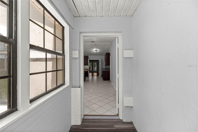 14171 SW 8th Ave, Ocala, FL 34473 - corridor featuring healthy amount of natural light and dark tile patterned floors
