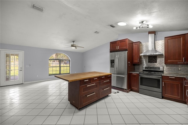 14171 SW 8th Ave, Ocala, FL 34473 - kitchen with appliances with stainless steel finishes, wall chimney range hood, wooden counters, lofted ceiling, and decorative backsplash