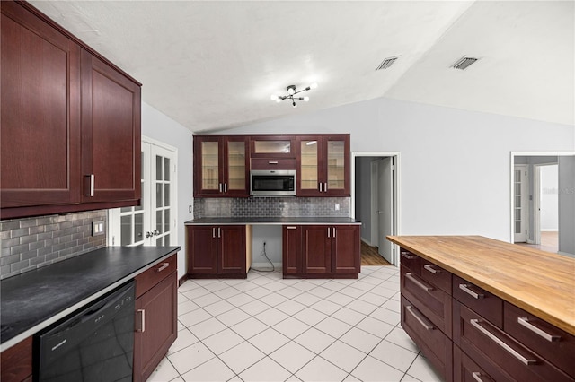 14171 SW 8th Ave, Ocala, FL 34473 - kitchen with dishwasher, stainless steel microwave, tasteful backsplash, vaulted ceiling, and light tile patterned flooring