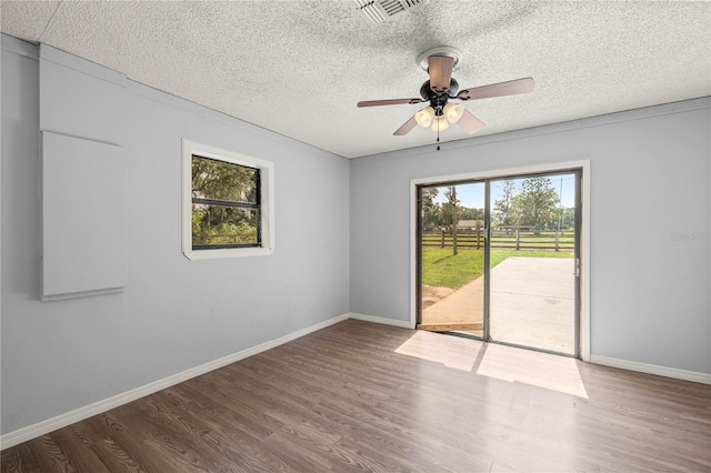 14171 SW 8th Ave, Ocala, FL 34473 - spare room with wood finished floors, a textured ceiling, and ceiling fan
