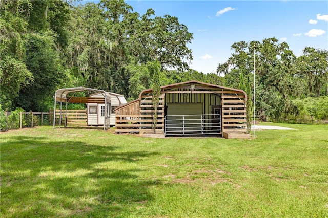 14171 SW 8th Ave, Ocala, FL 34473 - view of yard with a carport, an outdoor structure, and an exterior structure