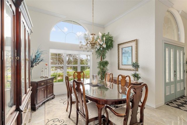 dining space with a chandelier, crown molding, and baseboards