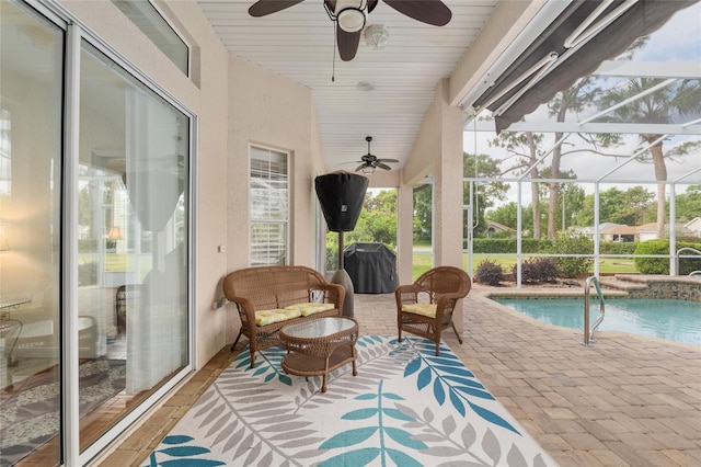 exterior space featuring area for grilling, ceiling fan, a patio, and an outdoor hangout area