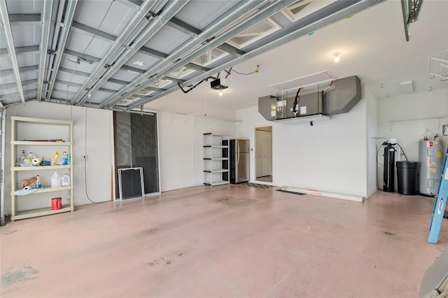 garage with a garage door opener, water heater, heating unit, and freestanding refrigerator
