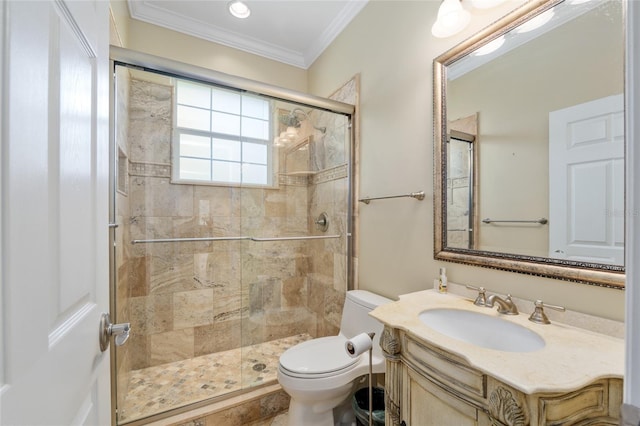 bathroom with vanity, toilet, ornamental molding, and a stall shower