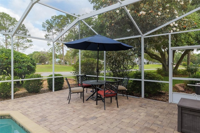 sunroom with outdoor dining space