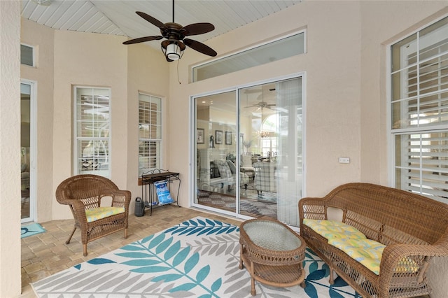 exterior space featuring ceiling fan