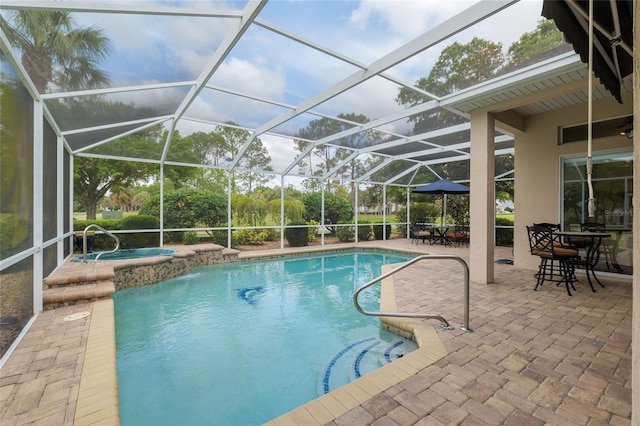 outdoor pool featuring a patio, an in ground hot tub, and a lanai