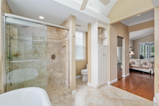 full bathroom with ornamental molding, a stall shower, ceiling fan, and ensuite bathroom