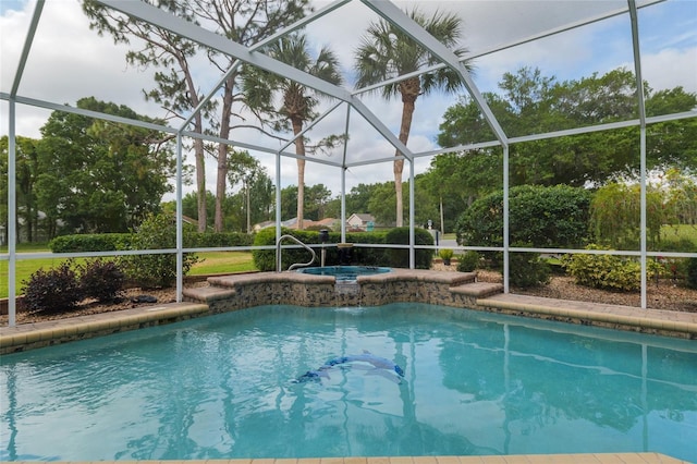 outdoor pool featuring an in ground hot tub and a lanai
