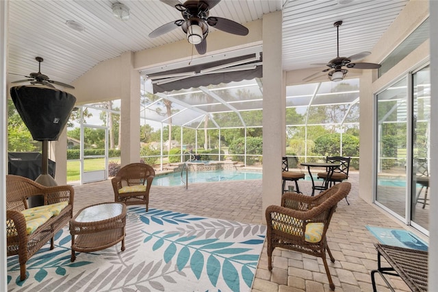 exterior space with a pool and ceiling fan