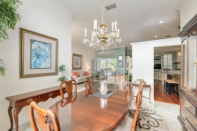 dining area with visible vents, recessed lighting, ornamental molding, and a notable chandelier