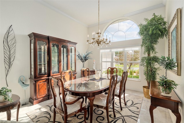 dining room featuring a chandelier, ornamental molding, a wealth of natural light, and a towering ceiling