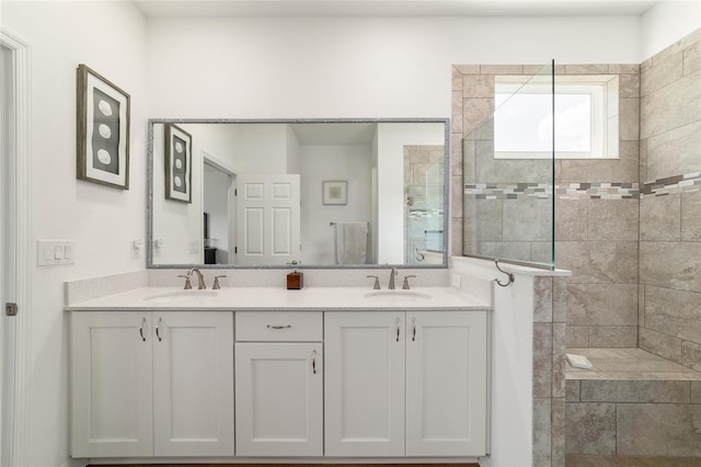 full bath with walk in shower and double vanity