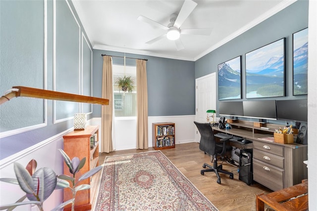 office space featuring crown molding, wood finished floors, and a ceiling fan
