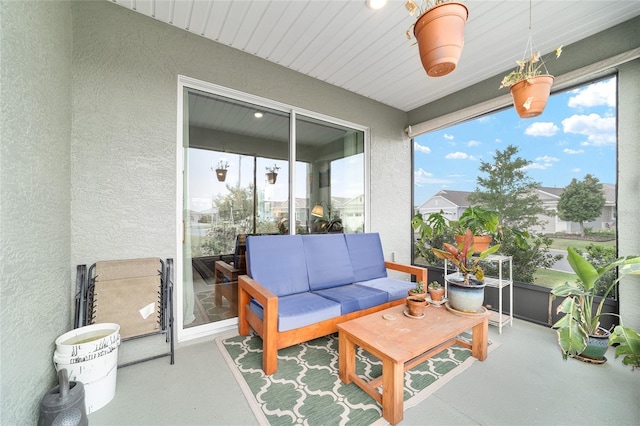 sunroom with a textured wall
