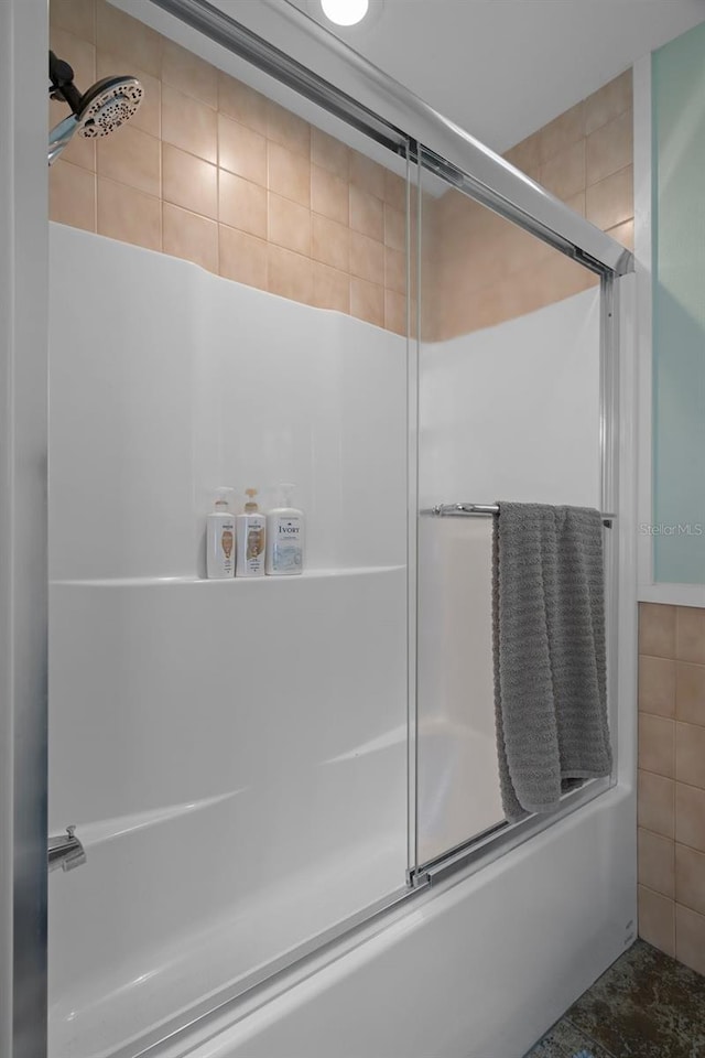 bathroom featuring enclosed tub / shower combo