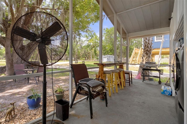 view of patio / terrace featuring stairway and a ceiling fan