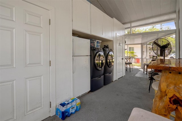 clothes washing area with washing machine and dryer